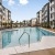 saltwater pool with surrounding seating and closeness to apartment homes