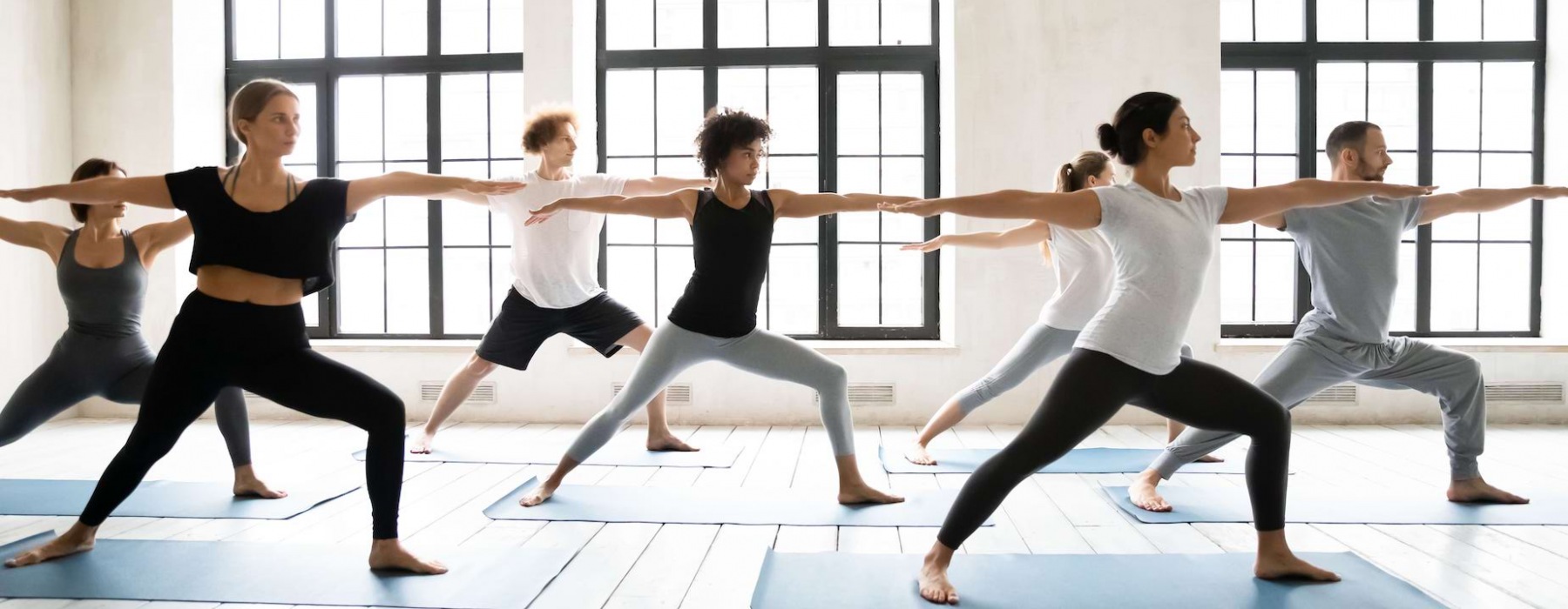 Group of women doing yoga exercise in a yoga studio in Pensacola